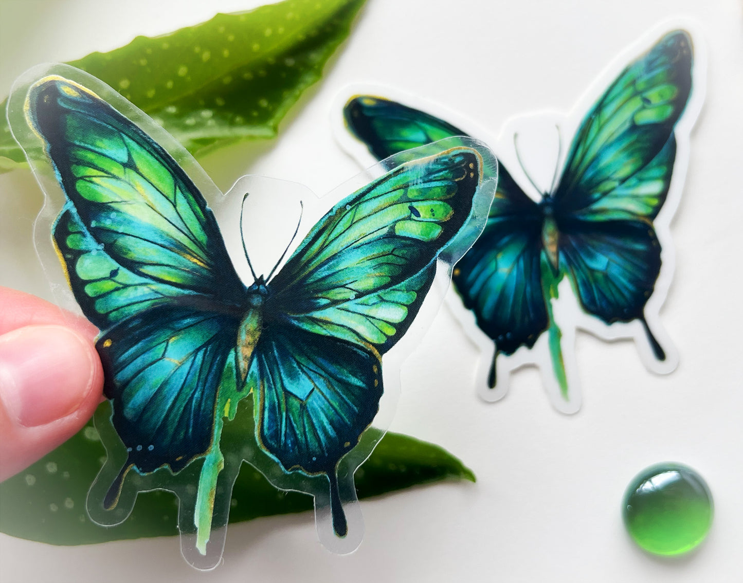 Transparenter Sticker blau-grüner Schmetterling